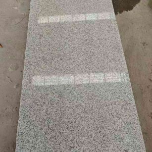 本溪芝麻白光面毛板